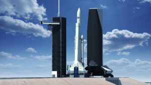 Falcon Heavy s větším aerodynamickým krytem a vertikální obslužnou věží