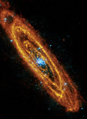 Snímek galaxie M31 pořízený infračerveným teleskopem Herschel (oranžové oblasti) a XMM-Newton pracující v rentgenové oblasti (modré prvky).