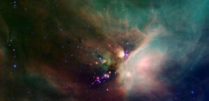 Hvězdná kolébka pozorovaná pomocí Spitzerova dalekohledu. Infračervené záření umožňuje proniknout hluboko do mlhoviny ró Oph v Hadonoši, která je okolo 410 světelných let od Země
