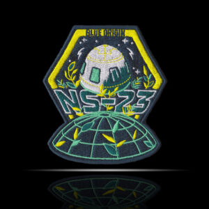 Logo bezpilotní mise NS-23.