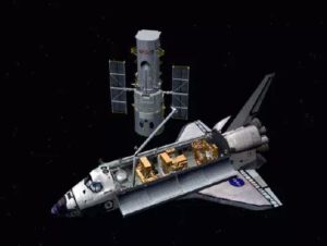 Raketoplány zachytávaly Hubbleův teleskop pomocí svého manipulátoru. Bude zajímavé sledovat, jaká metoda bude doporučena u Crew Dragonu.