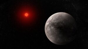 Planeta TRAPPIST-1 b i s mateřskou hvězdou v představách umělce.