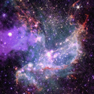 Hvězdokupa NGC 346 pohledem Webbova teleskopu a observatoře Chandra. Byla využita dodatečná data z Hubbleova a Spitzerova teleskopu, jako podpůrná data posloužila měření z XMM-Newton a New Technology Telescope.Barevná legenda: Rentgenové záření: fialová a modrá, infračervené / viditelné záření: červená, zelená, modrá