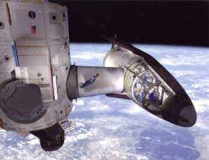 Umělecké zobrazení X-38 připojeného k ISS
