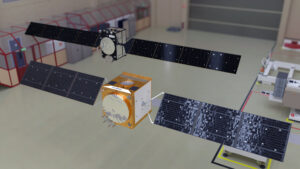 Modely družic Galileo druhé generace. V popředí návrh od firmy Airbus, v pozadí pak návrh od firmy Thales Alenia Space.