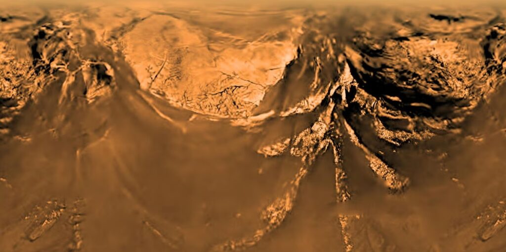 Povrch Titanu ze sondy Huygens, Zdroj: ESA/NASA/JPL/University of Arizona, https://hips.hearstapps.com/