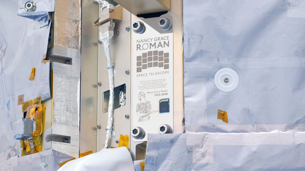 Close ups of a spacecraft in an industrial high bay.
